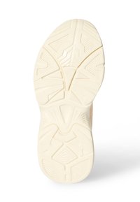 Suola di scarpa di colore crema con motivi geometrici e una presa testurizzata su uno sfondo bianco.