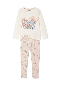 Helles Cremefarbenes Langarmoberteil mit grafischem Design von Cartoonfiguren, kombiniert mit rosa Leggings, die ein wiederholtes Muster von Figuren zeigen.