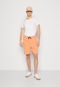 HUGO Treniņtērpa apakšdaļas - medium orange