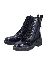 Paire de bottines à lacets en cuir verni noir brillant avec fermetures éclair sur le côté et semelles épaisses noires.