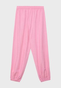 Pantalon en polaire rose avec taille élastique et poignets élastiques, présenté à plat sur un fond gris clair.