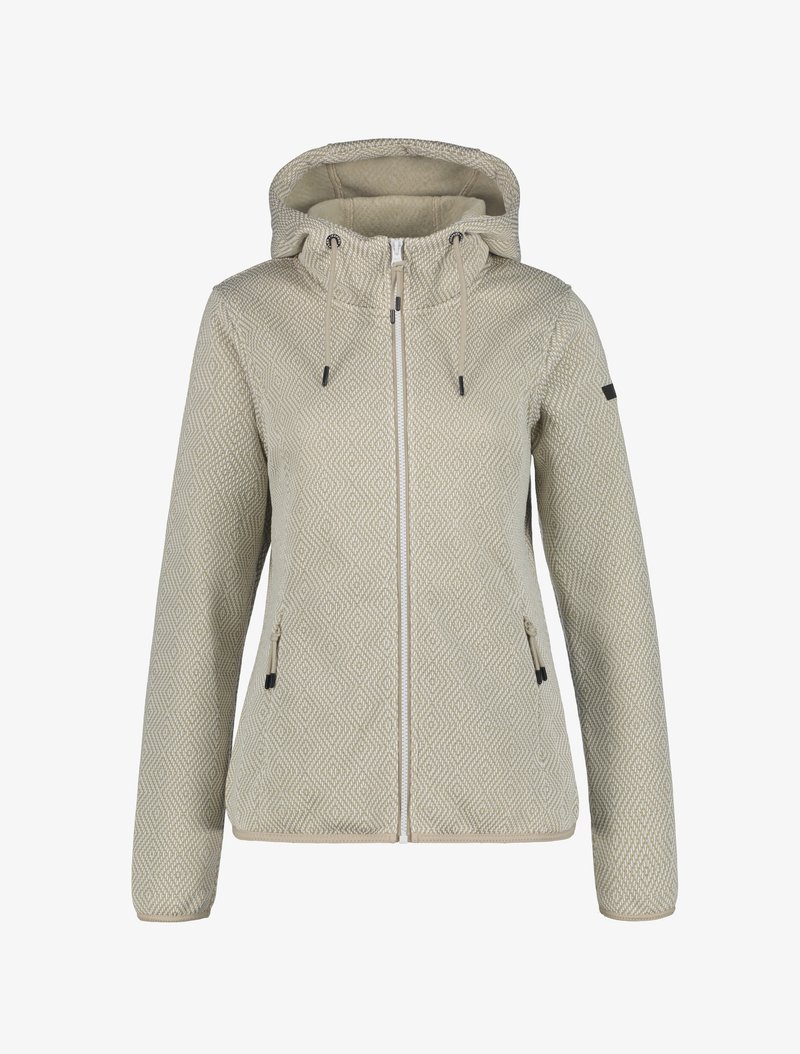 Veste zippée pour femme à motifs beiges avec capuche, cordons de serrage et poches latérales zippées, présentée sur fond blanc.