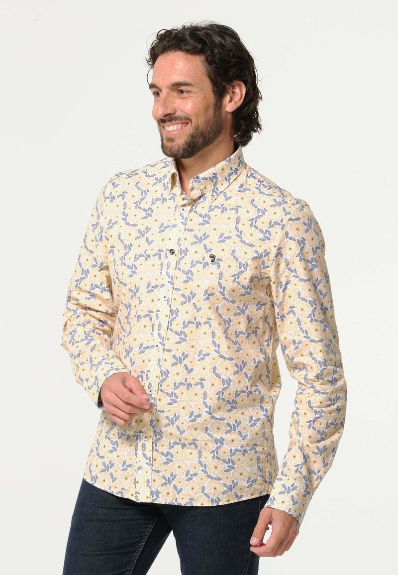Heren overhemd met knopen, versierd met een geel bloemenpatroon, gemaakt van lichtgewicht stof, met lange mouwen en een standaard kraagontwerp.