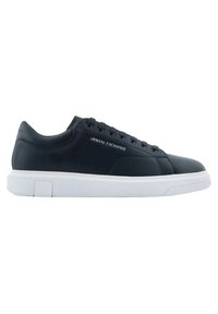 Black leather sneaker with white sole, features rounded toe, six eyelets, and ARMANI EXCHANGE logo embossed on the side.