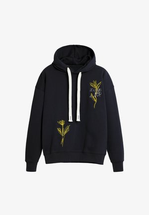 Marineblå hættebluse i blødt stof med gul blomsterbroderi på forsiden og hvide snore. Afslappet pasform og lange ærmer.