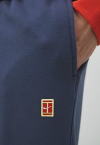 Nike Performance HERITAGE PANT - Tréningruha alsók - thunder blue