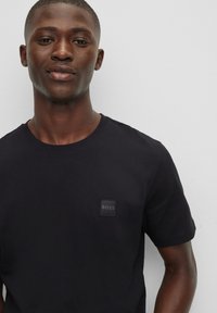 BOSS TALES - Basic T-shirt - black