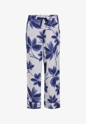 Białe luźne spodnie z dużym granatowym kwiatowym nadrukiem i granatowym sznurkiem w pasie.