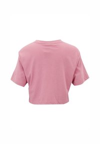 Rosa kortermet T-skjorte laget av myk bomull. Har rund hals og et enkelt, ensfarget design uten ekstra mønstre.
