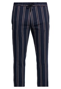 Námořnické kalhoty s vertikálními bílými a burgundskými pruhy, vybavené elastickým pasem se šňůrkou a tapered designem nohavic.