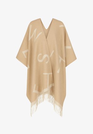 Coperta beige con scollo a V, caratterizzata da grandi lettere bianche su tutto il tessuto e rifinita con frange color crema sull'orlo.