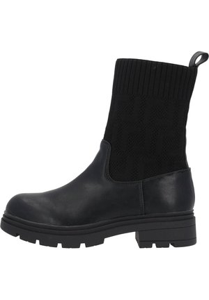Bottines noires avec une partie inférieure en cuir et un dessus en tricot côtelé. Possède une languette pour un enfilage facile et une semelle texturée pour une meilleure adhérence.
