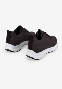 Dark brown sneakers with a smooth, synthetic upper, white midsole, textured accents, and rear pull tabs for easy wear.