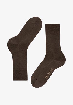 Calzini marroni realizzati in un materiale liscio, con una cima a coste e punta marcata, caratterizzati da un design semplice e senza cuciture per garantire comfort.