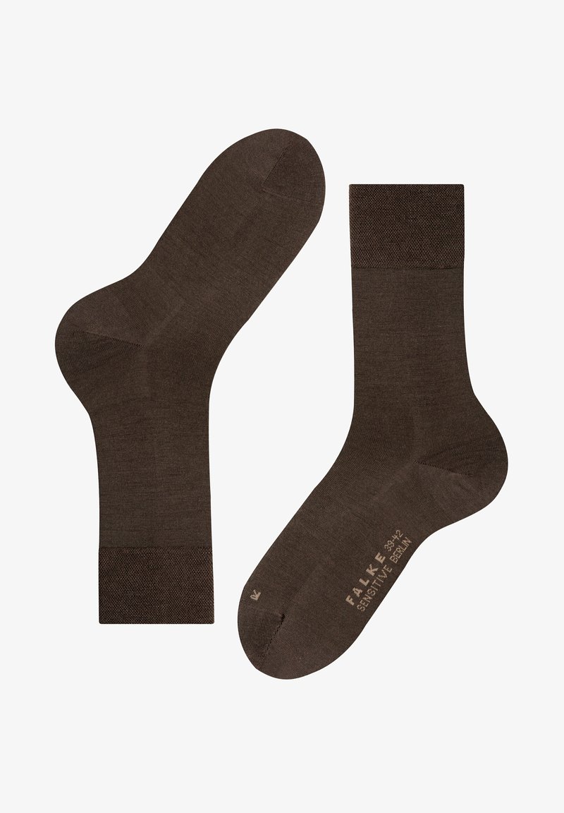 Chaussettes marron fabriquées dans un matériau lisse, avec une bordure côtelée et un orteil marqué, présentant un design simple et sans couture pour le confort.