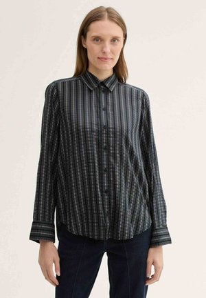 Black and white striped button-up shirt with long sleeves, a collar, and button details. The fabric has a soft, smooth texture.