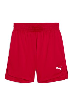 Pantaloncini sportivi rossi con fascia elastica in vita e piccolo logo Puma bianco sulla parte inferiore della gamba sinistra, mostrati su uno sfondo bianco semplice.