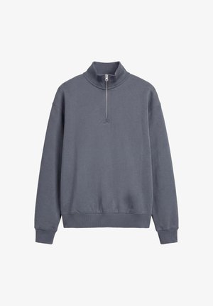 Pull à manches longues gris foncé avec poignets, ourlets côtelés et col à fermeture éclair partielle, présenté sur fond blanc.