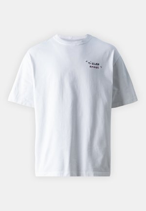 White short-sleeve T-shirt with small black and red text "Ti Giuro Amore" on the upper left chest, plain background.