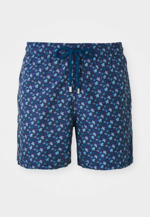Calções de banho em azul-marinho com um padrão floral em tons de azul e turquesa. Apresenta uma cintura com cordão para ajuste.