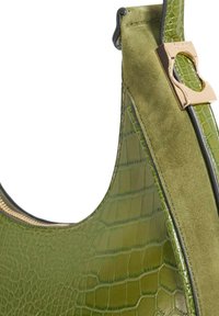Green leather handbag featuring a glossy crocodile texture, suede accents, gold hardware, and a rounded silhouette with a zipper closure.