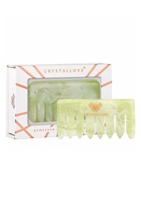 Groene edelstenen haarkam in een heldere doos met een witte achtergrond en rose-gouden accenten. De kam heeft afgeronde tanden en een gladde textuur.