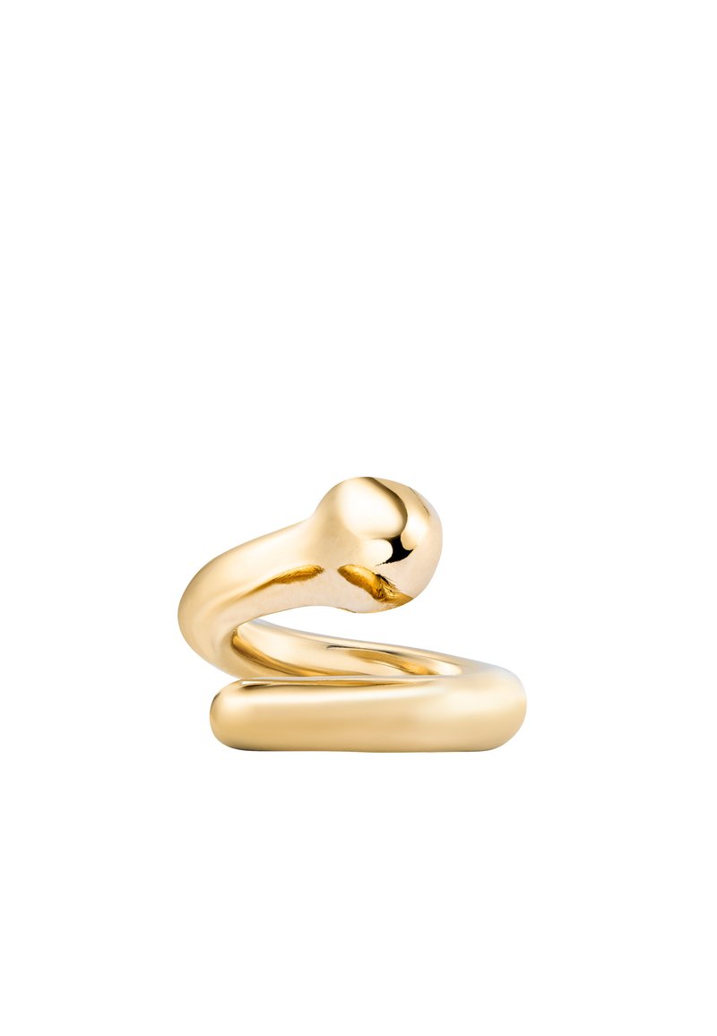 Figurine en métal doré cintré avec une texture lisse, présentant un sommet sphérique et une base cylindrique, créant une forme abstraite et fluide.