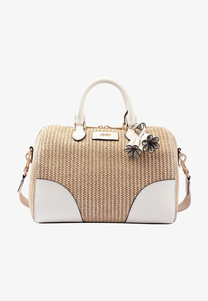 Sac à main tissé beige avec des poignées et des coins en cuir blanc, décoré de deux breloques fleurs noir et blanc fixées près de la fermeture éclair.