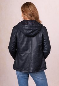 Black leather jacket with a hood, featuring a smooth texture and fitted design. Back view shows seam detailing and a slightly curved hem.