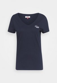Marinblå V-ringad kortärmad t-shirt med liten vit "Tommy Jeans"-logotyp på vänster bröst och märkesetikett i storlek small.