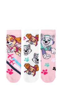 Set di tre calzini con personaggi di cani dei cartoni animati colorati. Sfondo rosa, bianco e rosa chiaro con impronte di zampe e design giocosi.