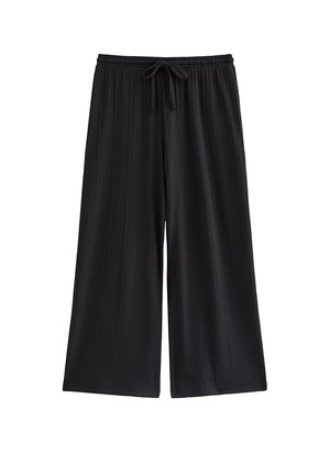 Pantalones negros de pierna ancha con textura acanalada vertical y una cintura elástica con cordón delantero.