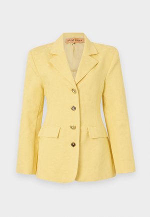 Yellow patterned blazer with a notched collar, single-breasted design, three front pockets, and gold-tone buttons. Smooth fabric texture.