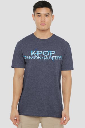 Young man wearing navy blue T-shirt with "KPOP DEMON HUNTERS" text in blue gradient, standing against plain light background.