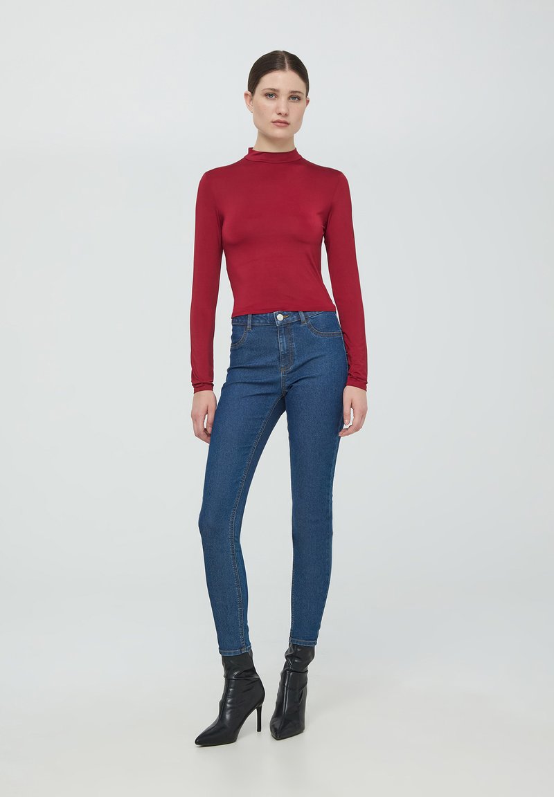 MISSGUIDED Crop top a maniche lunghe in in rete con effetto tie-dye