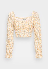 Avklippt blus med ett blommönster i gult och orange på en vit bakgrund. Långa, puffiga ärmar med rynkade manschetter. Mjuk tyg.