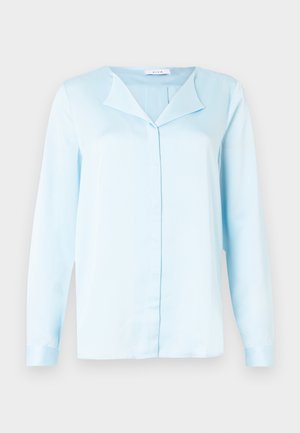 Light blue long-sleeve blouse made of smooth fabric, featuring a pointed collar, button-front closure, and cuffed sleeves.
