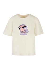 T-shirt crème à manches courtes avec une fille de dessin animé aux cheveux lavande et aux grands yeux au-dessus du mot "WHATEVER" en texte violet.