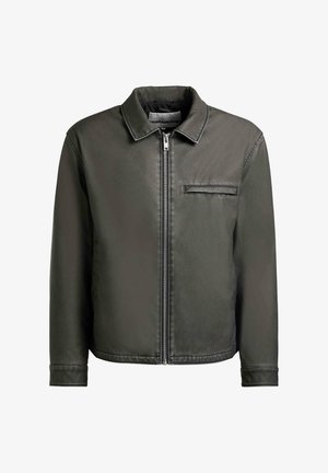 Donkergrijze neplederen jas met een rits aan de voorkant, een enkele borstzak, lange mouwen en een klassieke kraag.