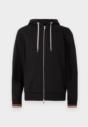 Svart zip-up hettegenser laget av mykt stoff, med snørehette, frontlommer og stripete detaljer på mansjettene.