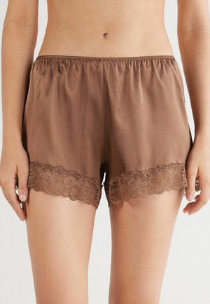 Bruine satijnen shorts met een elastische tailleband, voorzien van een geschulpte kantafwerking aan de zoom. Glad oppervlak en een ontspannen pasvorm.
