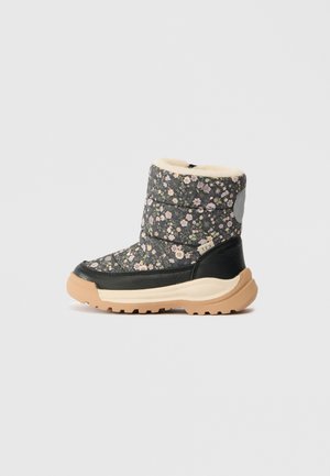 Child’s floral padded winter boot with black leather accents, beige sole, and soft cream lining.