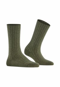 Calze verdi a coste con una finitura texturizzata e un leggero luccichio. Presentano un bordo standard e un design alla caviglia.