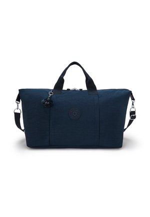 Blue nylon duffel bag with dual handles, detachable shoulder strap, subtle texture, logo patch, and a keychain monkey accent.