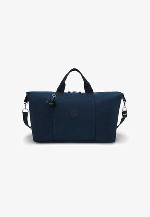 Sac de sport en nylon bleu avec deux poignées, bandoulière amovible, texture subtile, patch logo et un accroche-clés en forme de singe.