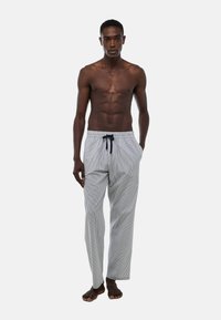 Pantalons de pyjama rayés en bleu clair et foncé, faits de tissu doux, dotés d'une taille élastique avec un cordon de serrage, au design à jambes droites.