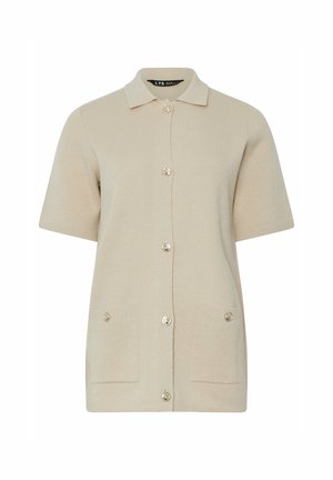 Beige short-sleeve cardigan with a collared neckline, five buttons down the front, and two patch pockets at the hips. Soft texture.