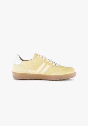 Light yellow suede sneaker with white laces, two side stripes, white heel tab, and gum rubber sole, shown in profile.