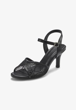 Sandalo nero con tacco alto, punta aperta, cinturino alla caviglia con fibbia e sovrapposizione di pizzo sulla fascia frontale.