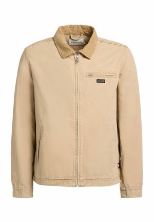 Beige jas met ritssluiting, corduroy kraag, twee zakken aan de voorkant en een klein ritssluitvakje op de rechterborst.